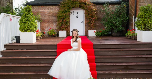 Bride On Red Carpet Outside The Kiln Room 